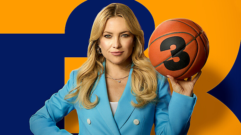 Woman in a blue blazer holding a basketball with the number 3, standing in front of an orange and blue background. Confident pose, studio setting.