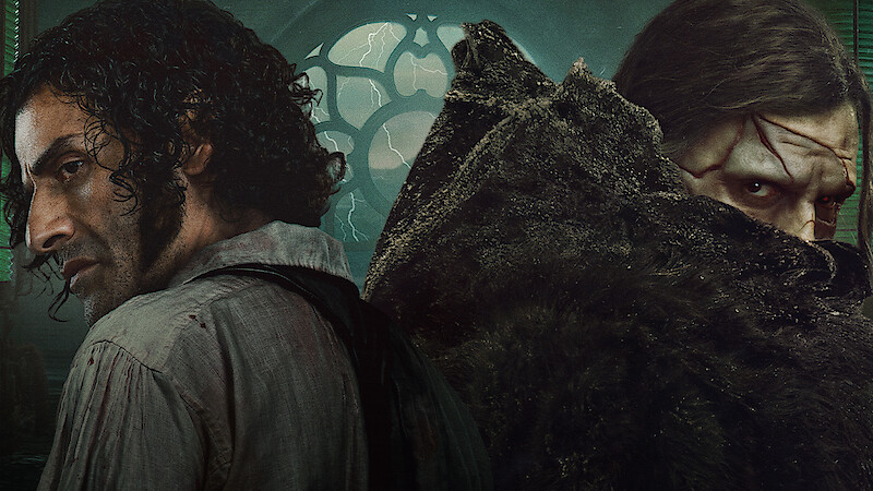 Two men stand back to back in a dark, gothic room with a large window and stormy light outside. One looks defiant, the other wears a cloak and looks intense. The mood is tense and mysterious.