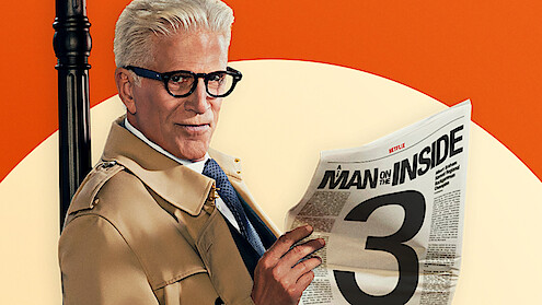 Older man in trench coat and glasses holds newspaper titled "Man on the Inside"; bold design with large number 3, orange and cream background, dramatic lighting, stylized promotional setting.