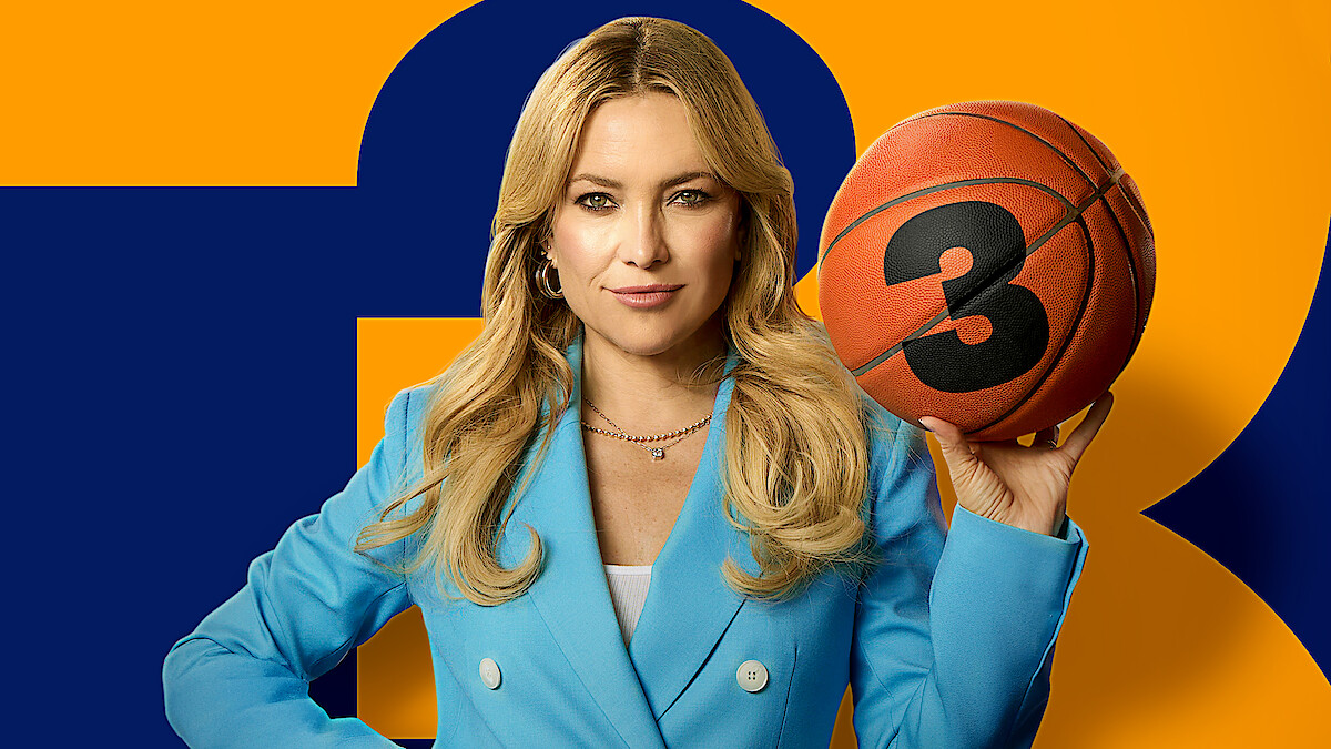 Woman in a blue blazer holding a basketball with the number 3, standing in front of an orange and blue background. Confident pose, studio setting.
