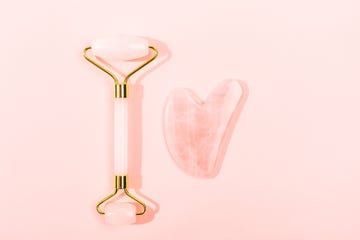 Pink Gua Sha facial massage tools.