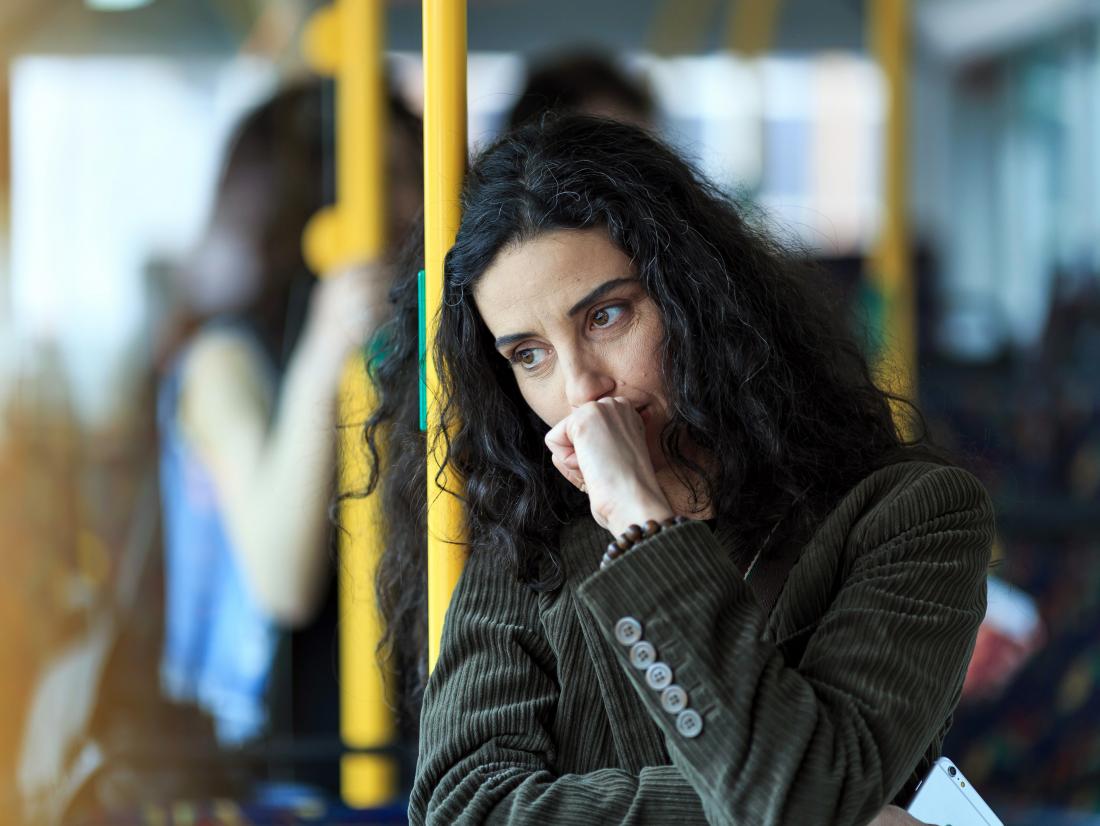 a pensive woman thinking about anal cancer