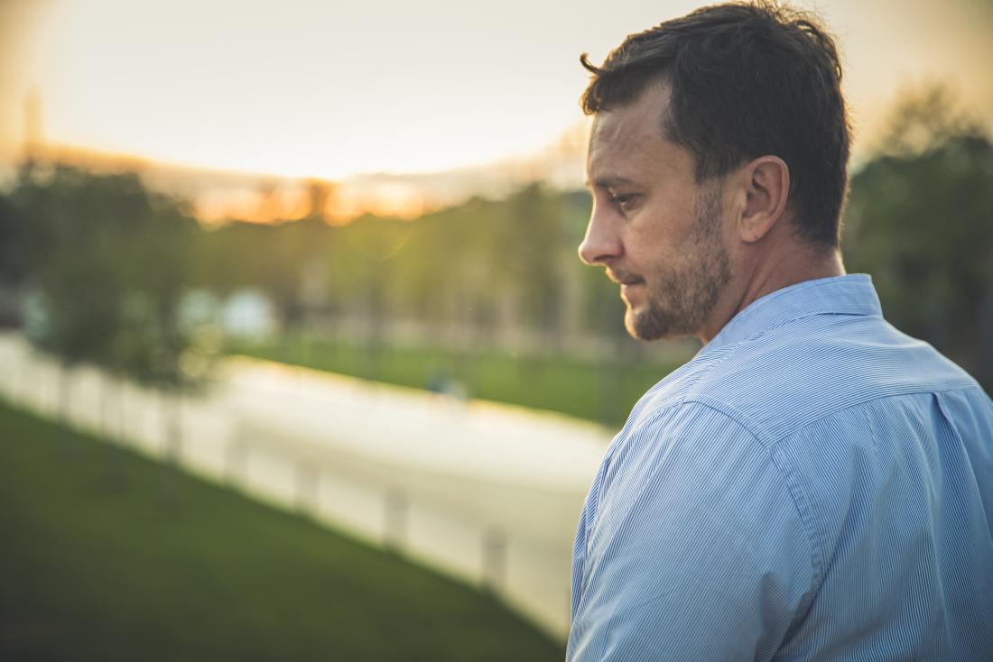 a man looking pensive about his bone marrow cancer diagnosis 