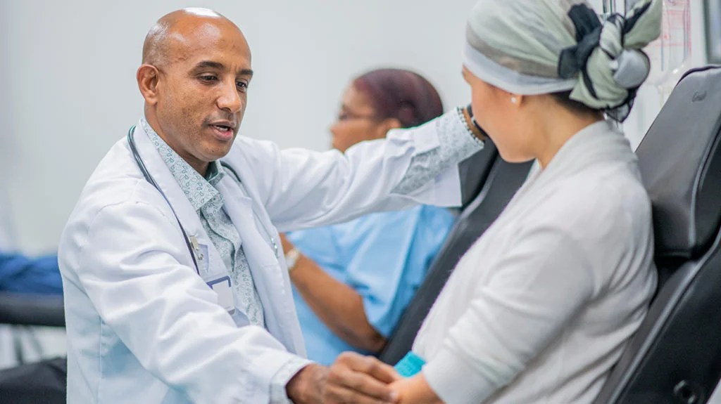 Oncologist working with a patient