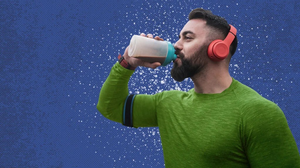 A person drinking a beverage high in protein. 