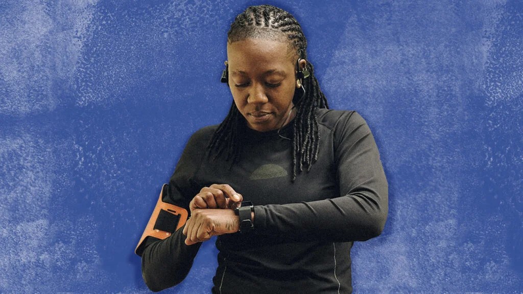 person looking at their wristwatch fitness tracker