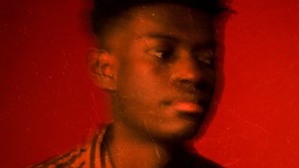 blurred headshot of a young man