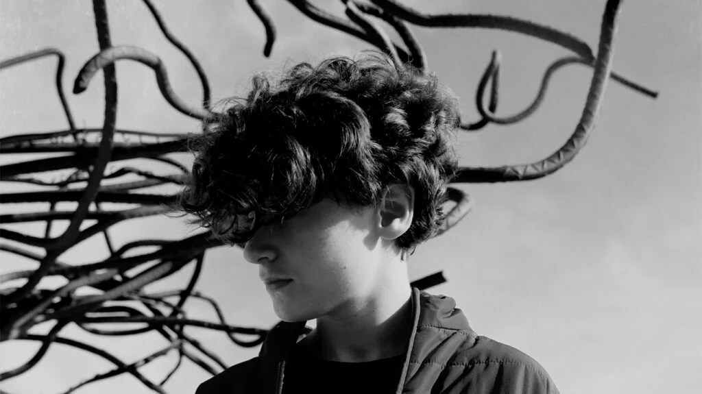 branches behind a boys head representing anxiety and paranoia