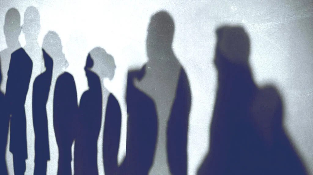 Shadows of people of different heights. 