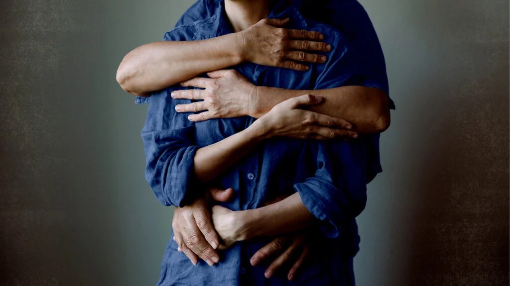 Intertwined arms of people, to represent chronic myeloid leukemia hereditary