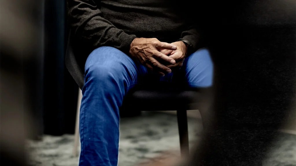 A person sitting on a chair.