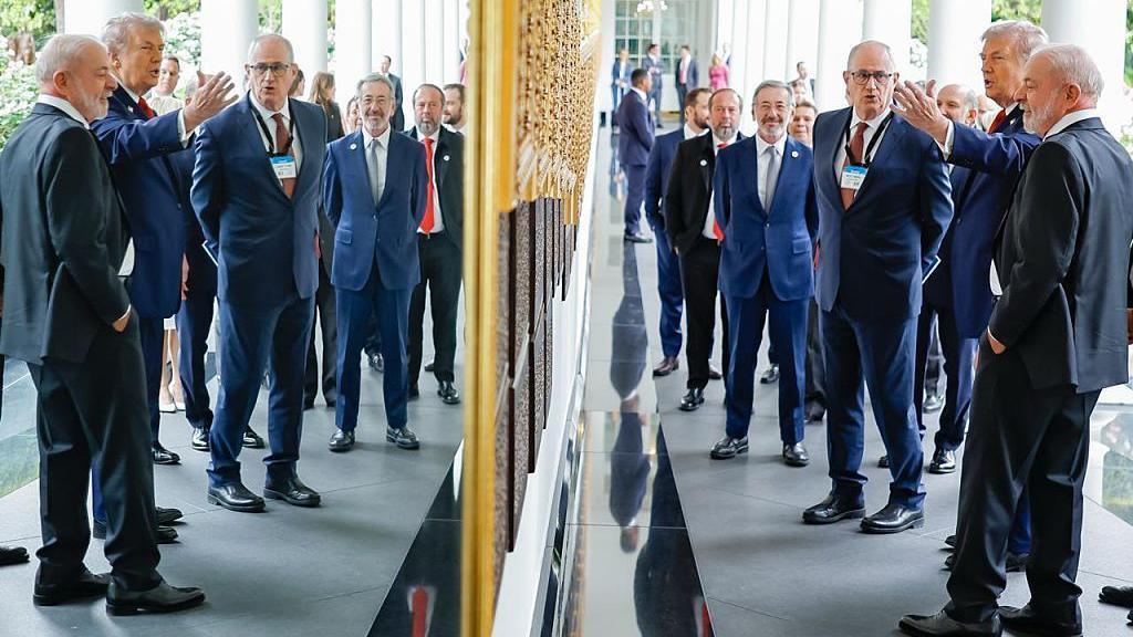 US President Donald Trump shows Brazilian President Luiz Inácio Lula da Silva around the White House grounds in this handout photo from the Brazilian government.