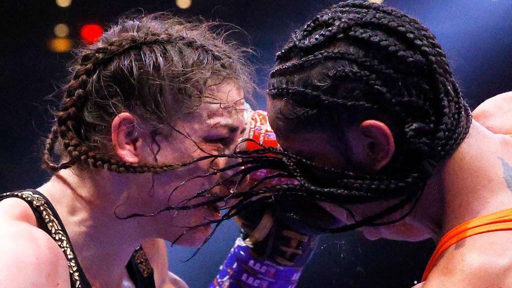 Katie Taylor and Amanda Serrano collide with hair and sweat flying