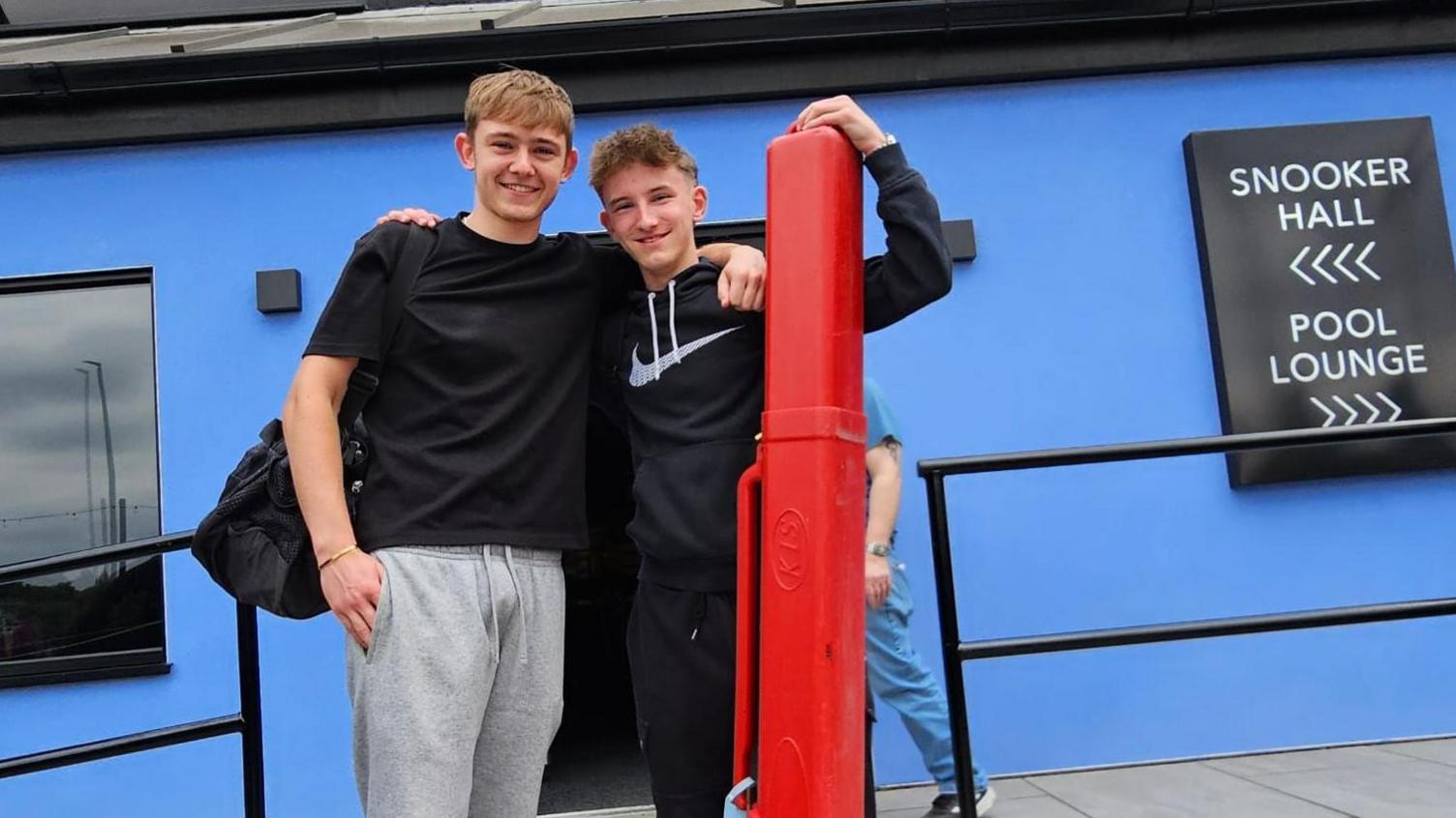 Two players pose for a picture outside the Norther Snooker Centre in Leeds