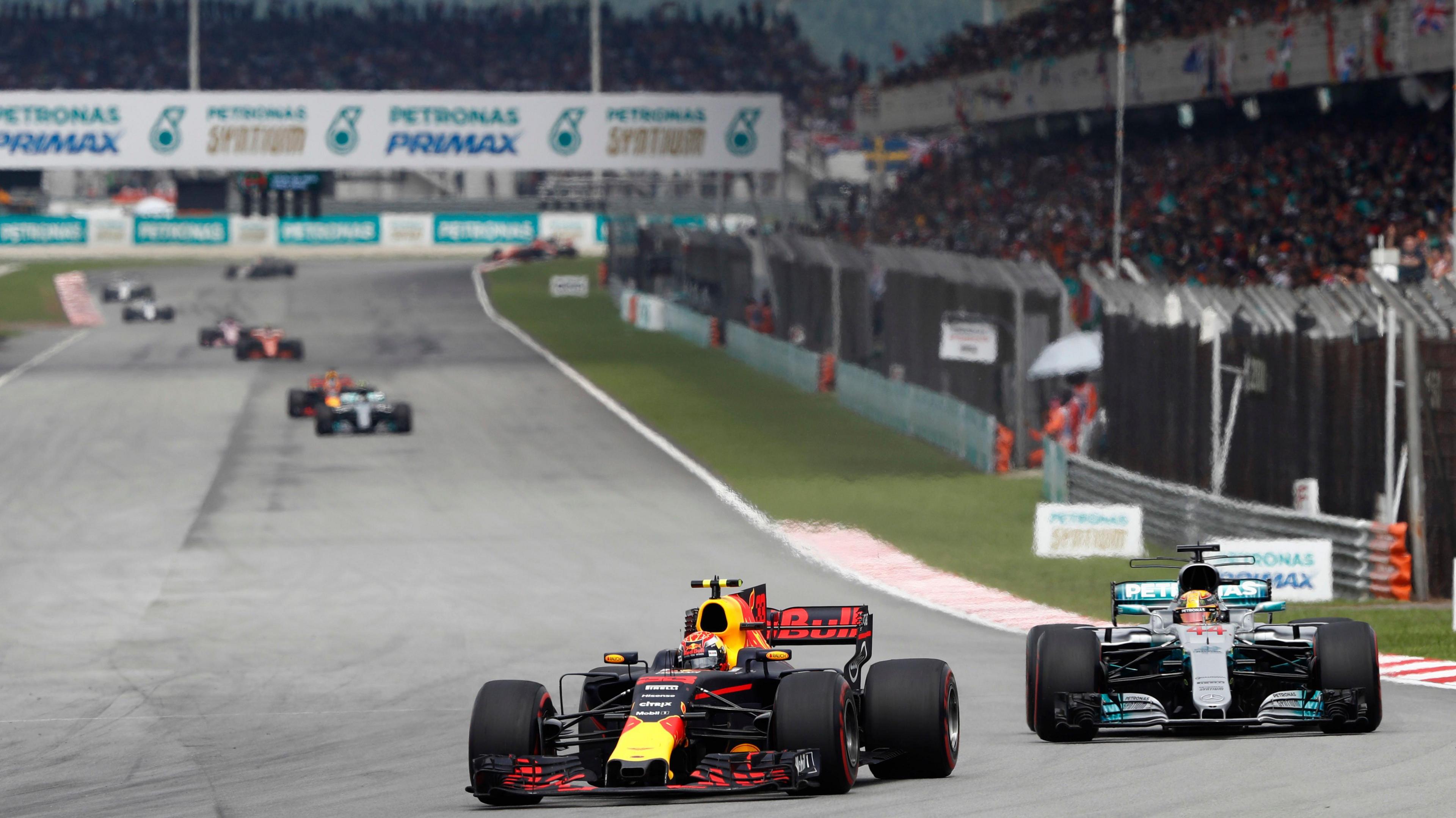 Red Bull's Max Verstappen leads Mercedes' Lewis Hamilton into the first corner of the 2017 Malaysian Grand Prix