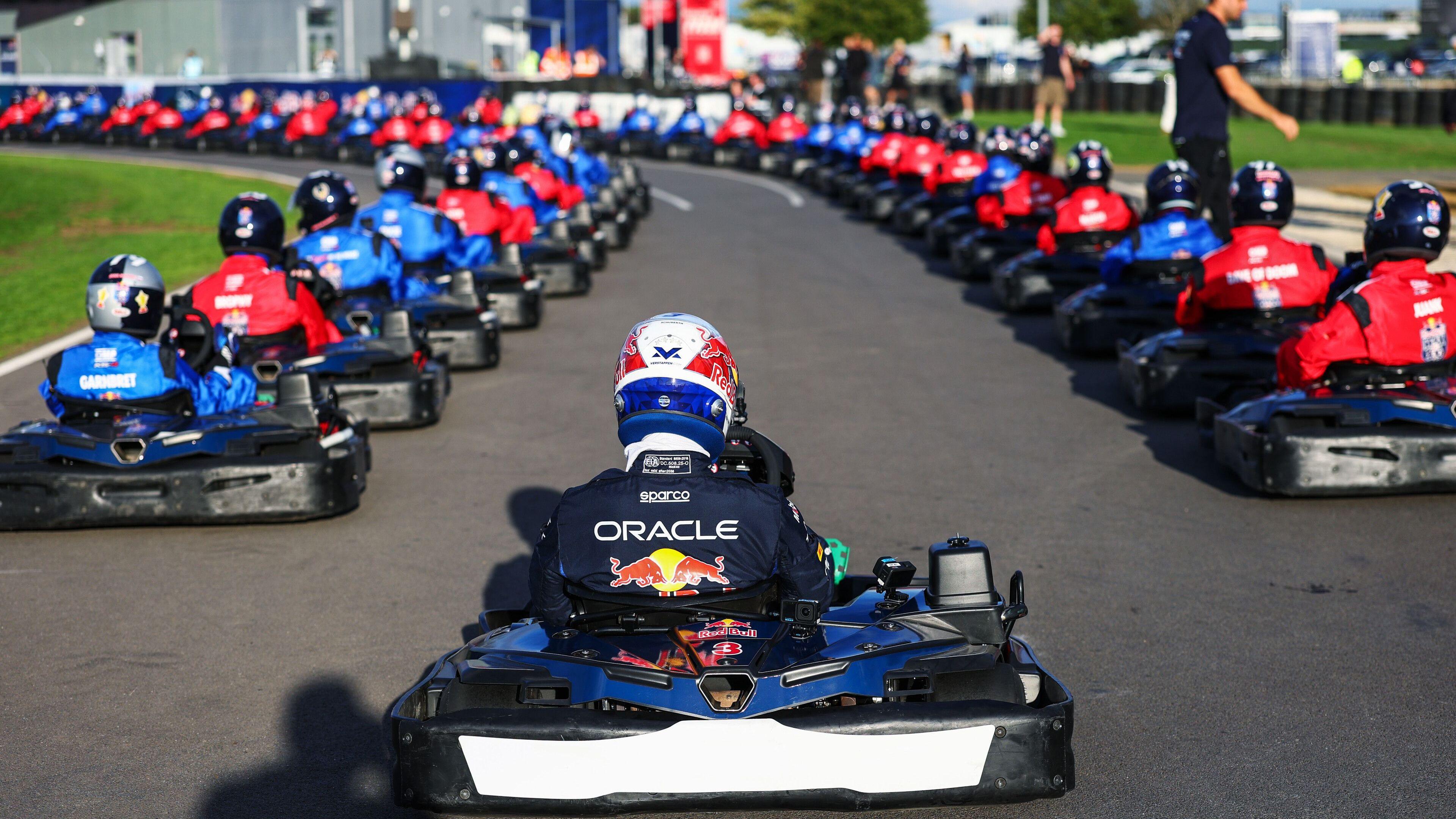 A photo from behind Max Verstappen at the back of the grid before the start of his 'Max vs 100' go-kart challenge