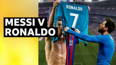 Cristiano Ronaldo and Lionel Messi holding their shirts up