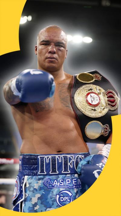 Fabio Wardley winning at Portman Road, holding the belt with ITFC written on his boxing shorts