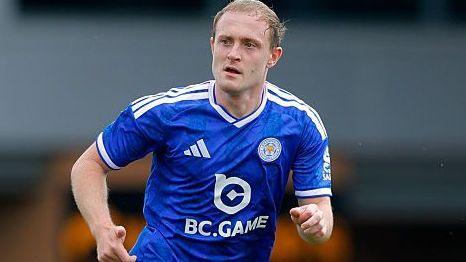 Oliver Skipp in blue Leicester shirt