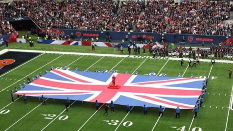 The United Kingdom flag on the Tottenham Hotspur Stadium pitch