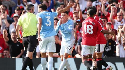 Manchester City's Phil Foden reacts after being sent off against Manchester United at Old Trafford