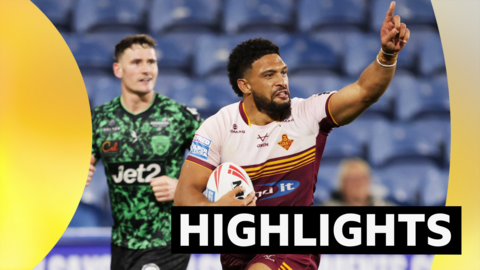 Huddersfield Giants' Taane Milne on his way to scoring a try against Leigh Leopards
