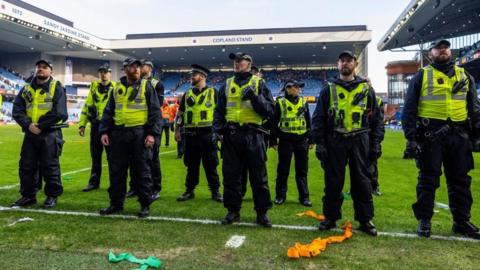 Police on the pitch at Ibrox Stadium