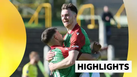 Jordan Jenkins celebrating a goal for Glentoran with Jordan Stewart