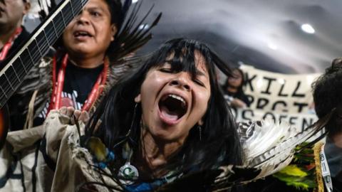 Indigenous people demonstrate in the Blue Zone of COP30 in Belem
