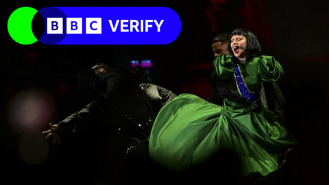 Lady gaga in green dress during concert