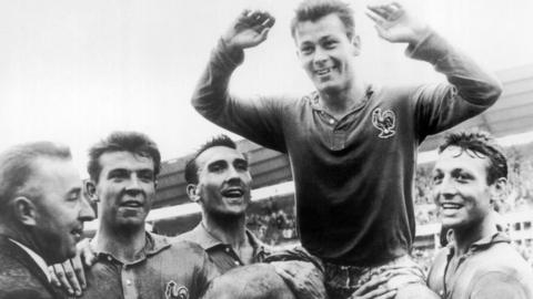 Just Fontaine being lifted up by his France team-mates at 1958 World Cup