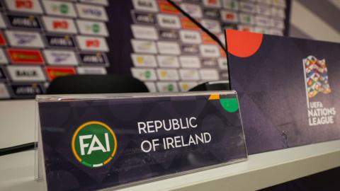Republic of Ireland signage at the top table of the news conference 