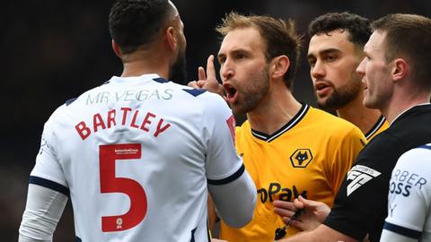 West Bromwich Albion's Kyle Bartley and Wolverhampton Wanderers' Craig Dawson get into a heated exchange in their FA Cup match in 2024