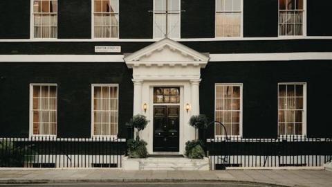 Maison Estelle is located within a large black and white Georgian townhouse, with planted trees flanking the porch and long windows overlooking Grafton Street