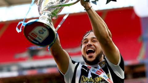 Jodi Jones of Notts County lifts the League Two Play-off Final trophy after helping to win promotion back to League One (25 May 2026)