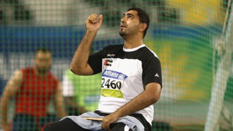 Abdullah Hayayei warming up in a shot put cage