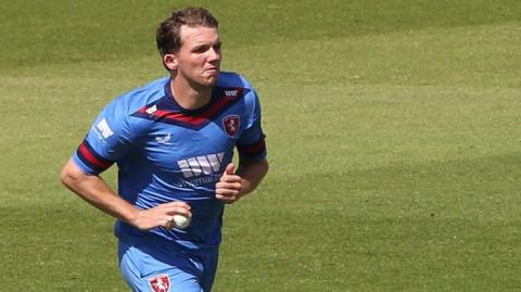 Matt Milnes bowls for Kent in their sky blue limited-overs kit