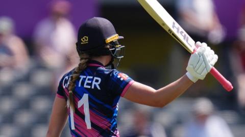 Scotland's Darcey Carter raises her bat