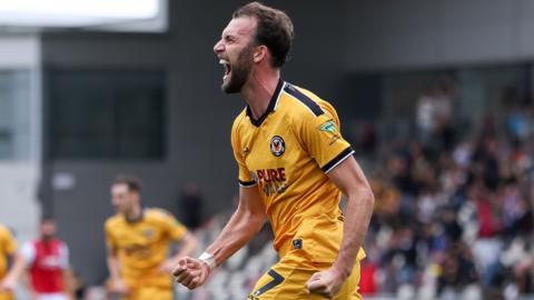 Christian Doidge celebrates his first goal for Newport County
