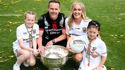 Mayo manager Andy Moran with his wife Jennifer, and children Charlotte and Ollie with the Sam Maguire Cup