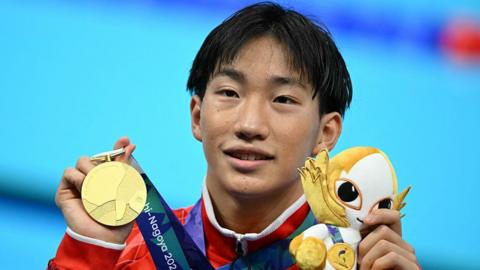 Shin Ohashi with his gold medal after winning the 200m breaststroke at the Asian Games