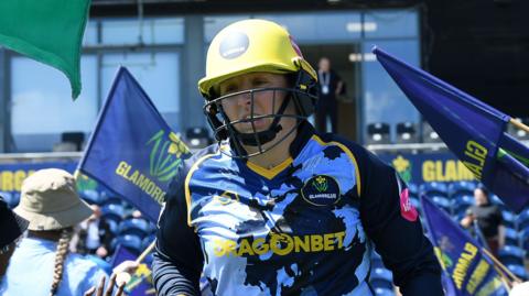 Lauren Parfitt coming out to bat in a game this summer 
