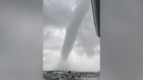 A tornado above a car park.