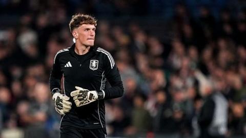 Aston Villa goalkeeper Sam Proctor warms up prior to the Europa League tie against Feyenoord at De Kuip, Rotterdam (2 October 2025)