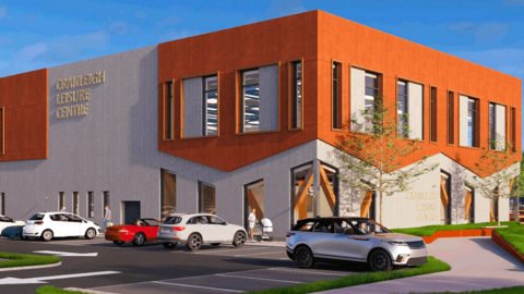 A CGI image of a new leisure centre painted orange and grey