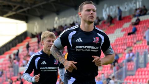 Jayden Wareham warming up before a game for Exeter City