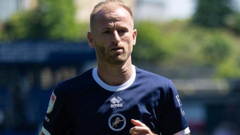 Barry Bannan in action for Millwall in their dark blue home shirt