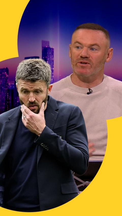 Wayne Rooney looks at a cutout of a stressed Michael Carrick