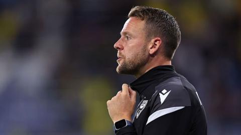 Chris Gunter looks on from the touchline