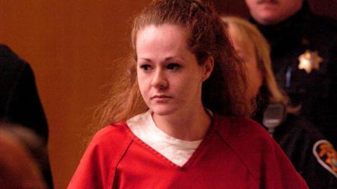 Christa Pike enters a courtroom in 2007 